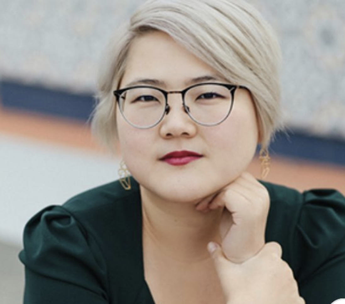 Photo of ace author Angela Chen wearing glasses and lipstick 