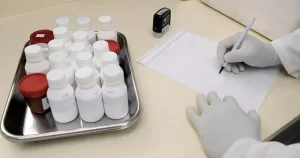 This article is about case of gonorrhoea in Ireland. In the photo, the hand of a doctor writing on paper with some medical equipment.