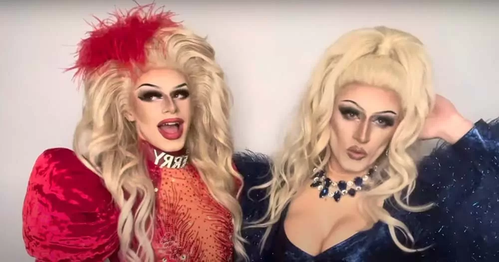 Image of gay footballer Zander Murray posing in full drag next to rising drag star Cherry West.