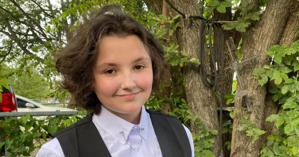 This article is about the Human Rights Campaign responding to the death of Nex Benedict. The image is of Nex, photographed from the chest up, smiling at the camera and wearing a white shirt and dark grey waistcoat.