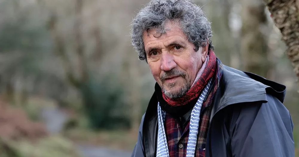 Former journalist Charlie Bird, looking at the camera while sitting in nature.