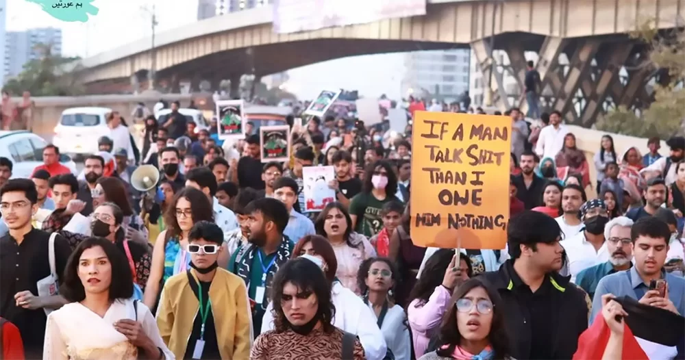 The picture shows participants marching at the Aurat March 2024 in Karachi, Pakistan.