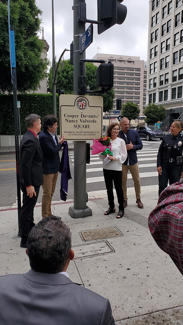 Image of Nancy Valverde getting a road named after her in recognition of her life and devotion to the lesbian community.