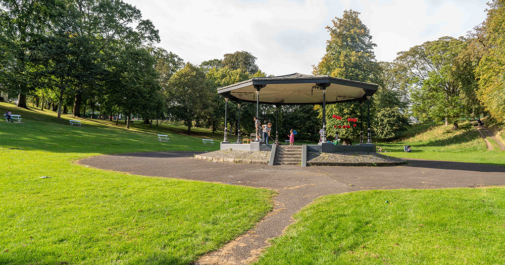 This article is about the teenager charged over an incident in Phoenix Park saying that he is not homophobic. The image shows the park, with lots of green grass and trees as well as a sheltered area in the middle of the image.