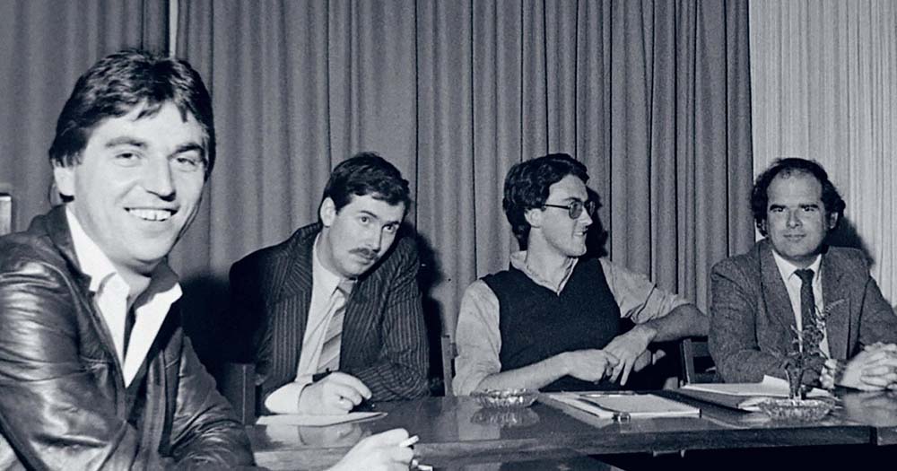 Black and white photo of four men in suits representing the Irish Gay Rights Movement