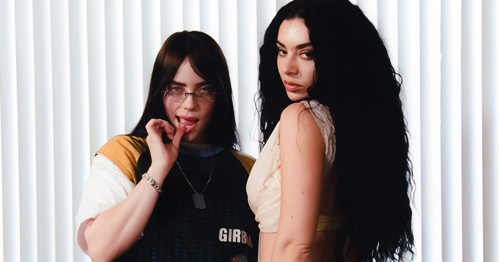 Billie Eilish and Charli XCX pose for a photo together.