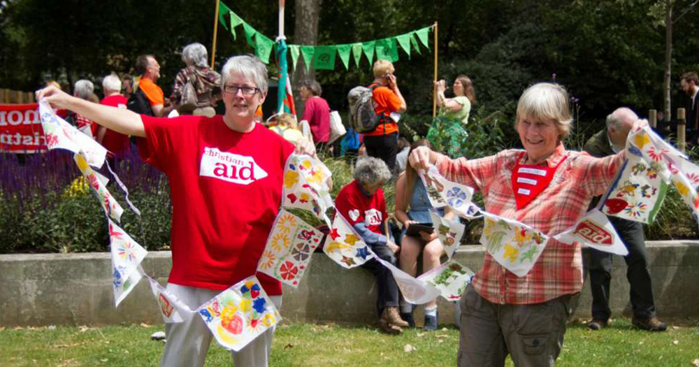 This article is about Christian Aid and Queen's University Belfast who together produced 56-page booklet on 'queering the peace agenda'. The photo used shows two christian aid volunteers.