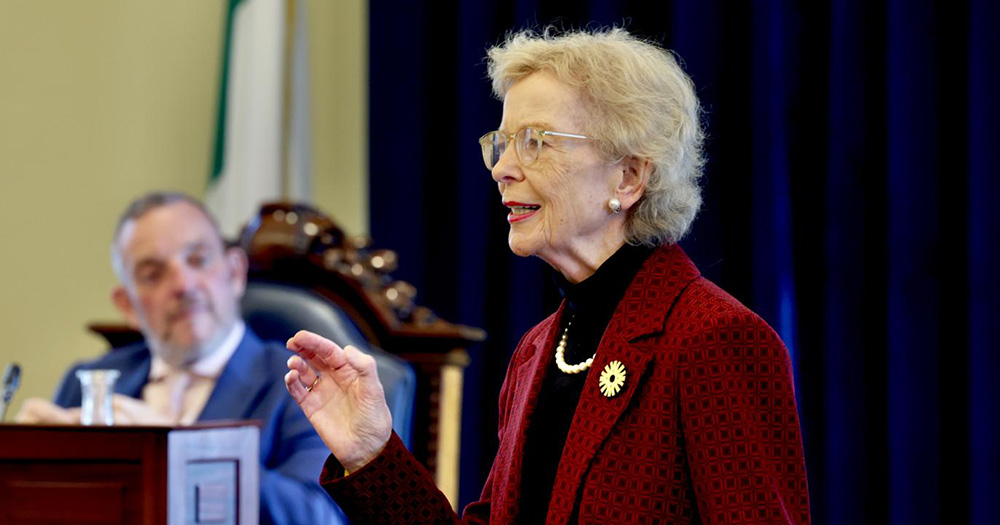 Mary Robinson photographed from the torso up addressing the Seanad.