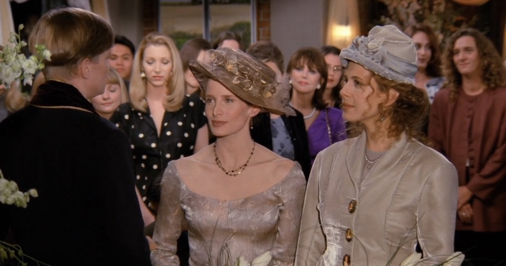 Screenshot of first televised lesbian wedding on sitcom Friends, with the two women getting married in front of a crowd.