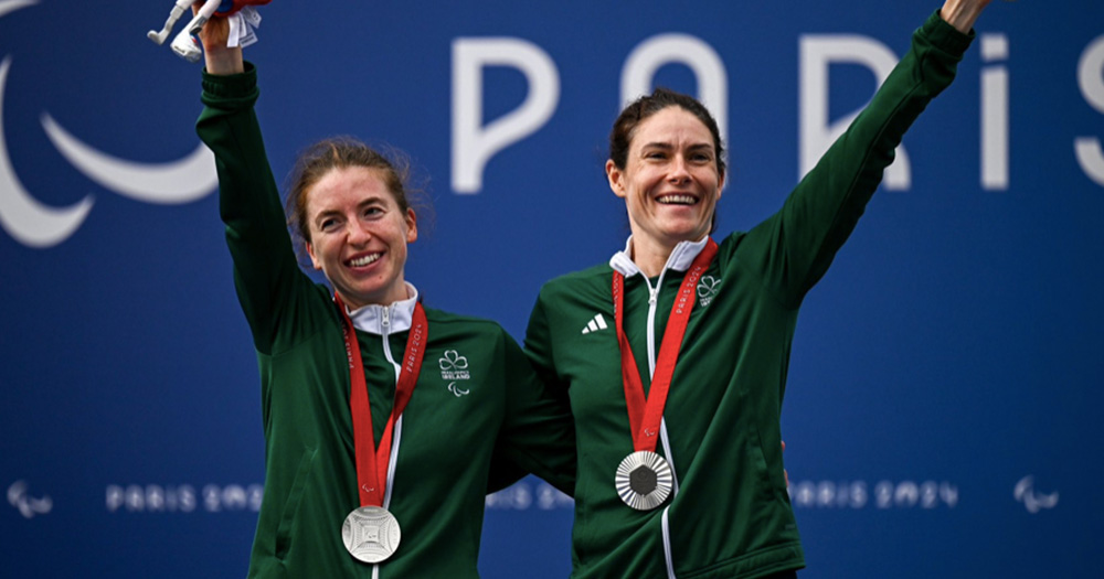 katie george dunlevy and her co pilot celebrate their third medal