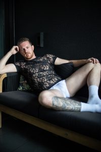 Photo from Melbourne Issue of Elska magazine, portraying a man lying on a couch in his underwear.