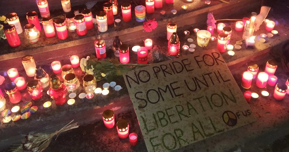 This article is about a terrorist group tied to the 2022 Slovakia shooting. In the photo, candles at a vigil held after the shooting, with a sign that reads "No pride for some until liberation for all".