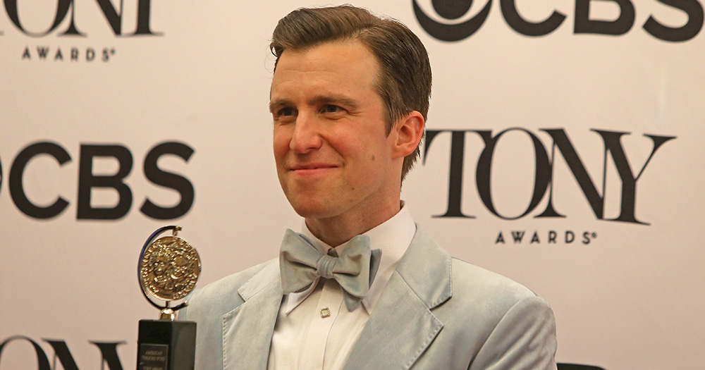 Gavin Creel posing with his Tony Award.