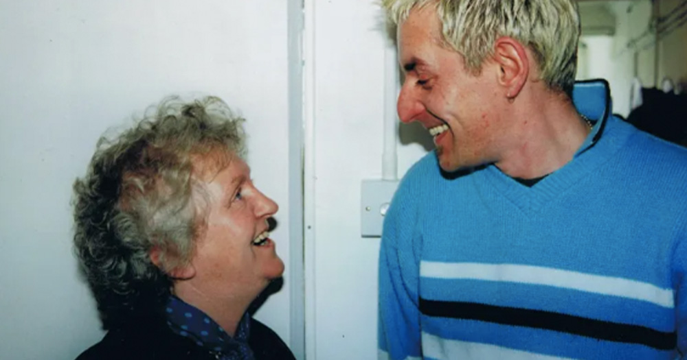 An image of Nell McCafferty and Tonie Walsh laughing in conversation.