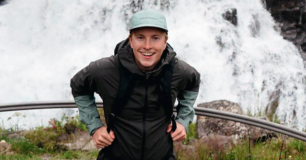 Janne Puhakka, who was found dead, during an excursion smiling at the camera with falls behind him.