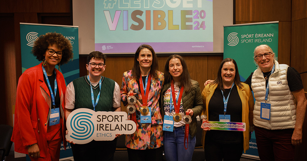 Katie-George Dunlevy posing for a photo with representatives of Sport Ireland and Sporting Pride at the Let's Get Visible event.