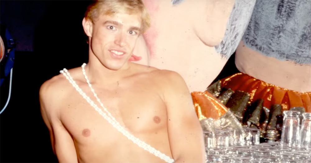 A screenshot from the Studio One Forever documentary showing a photo of a shirtless man posing for a photo in the nightclub.