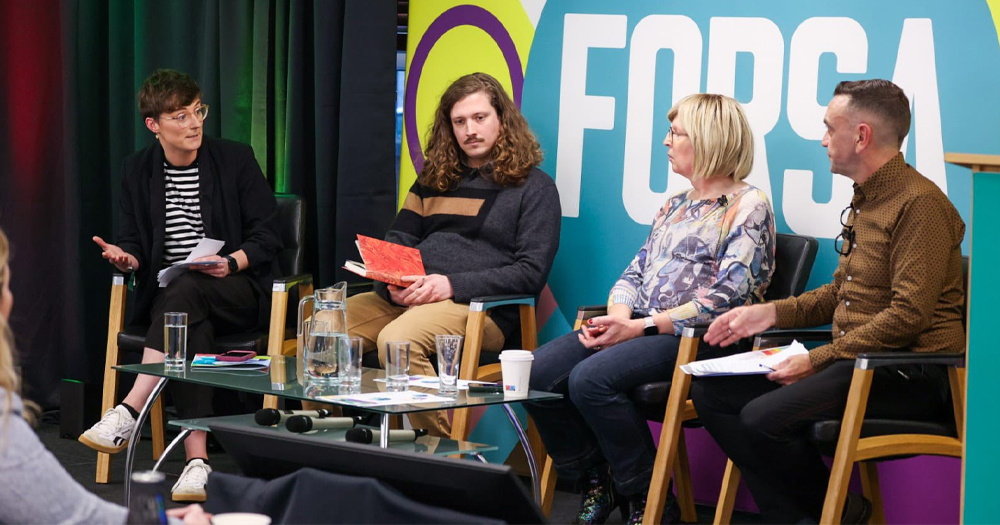 Photo taken at the launch of Forsa's LGBTQ+ network, with a panel of speakers sitting together and talking in front of an audience.