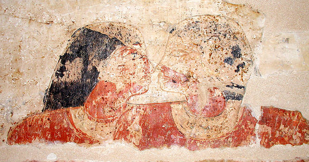 Headshot of the depiction of the Egyptian tomb of the gay couple Niankhkhum and Khnumhotep touching noses.