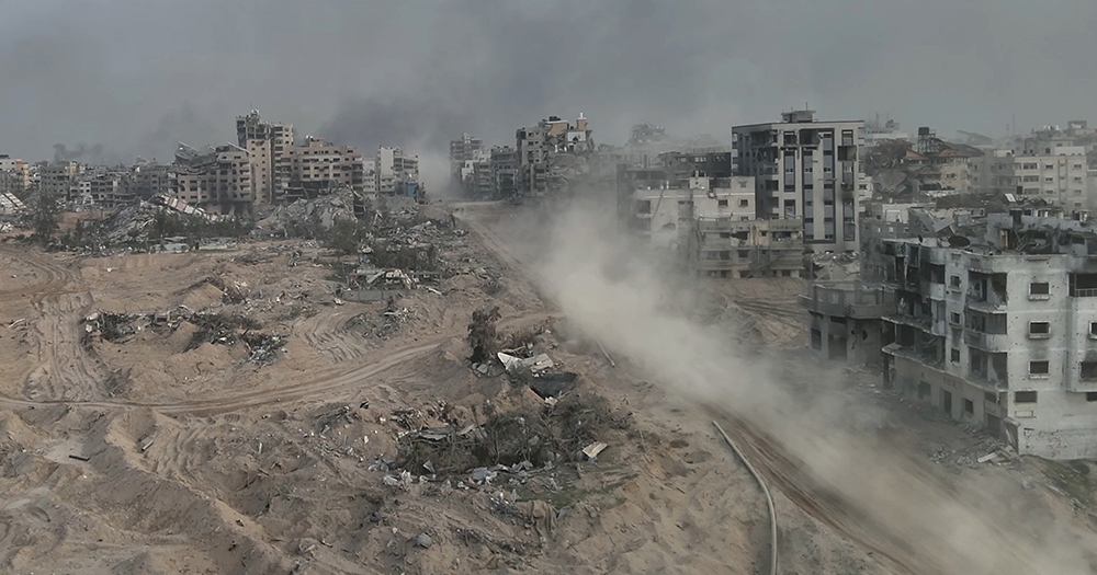 This article is about Ireland joining the genocide case against Israel. In the image, a photo of Gaza with buildings destroyed by Israeli bombings.