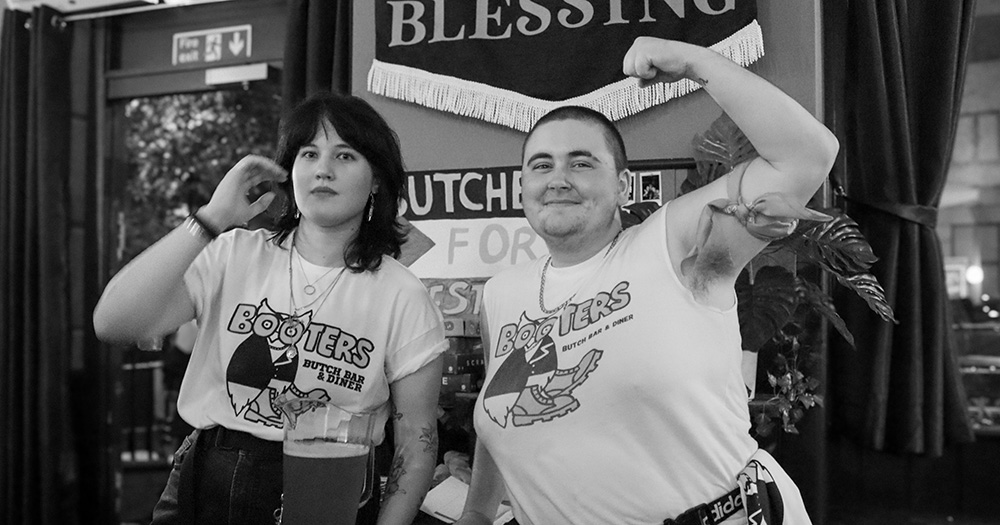 A black and white image of two people from Booters, one of London's popular queer events.