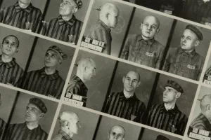 Prisoners photographed wearing the pink triangle. Image via Auschwitz.net