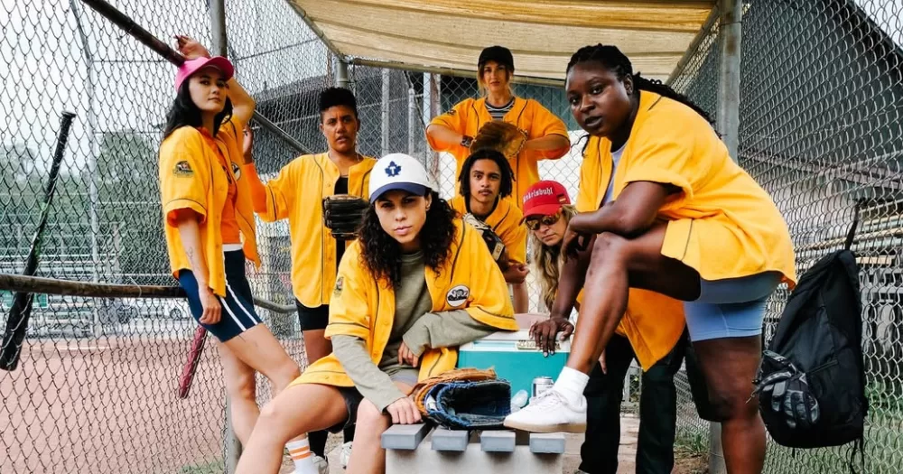 Cast of Slo Pitch pose together