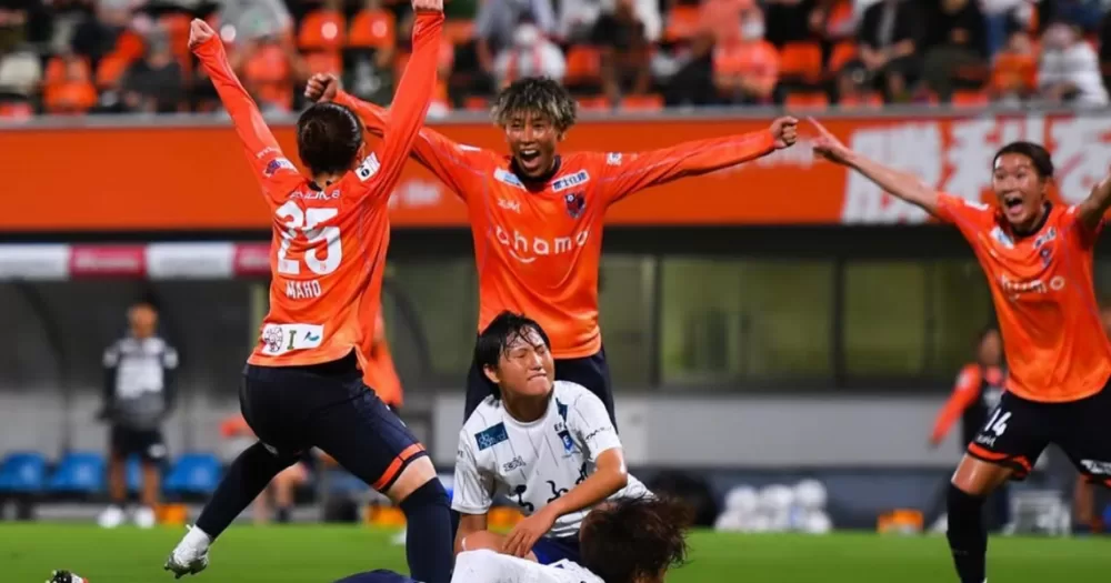 Marumi Yamazaki Japanese football player who recently came out as trans. Celebrates a win on the pitch