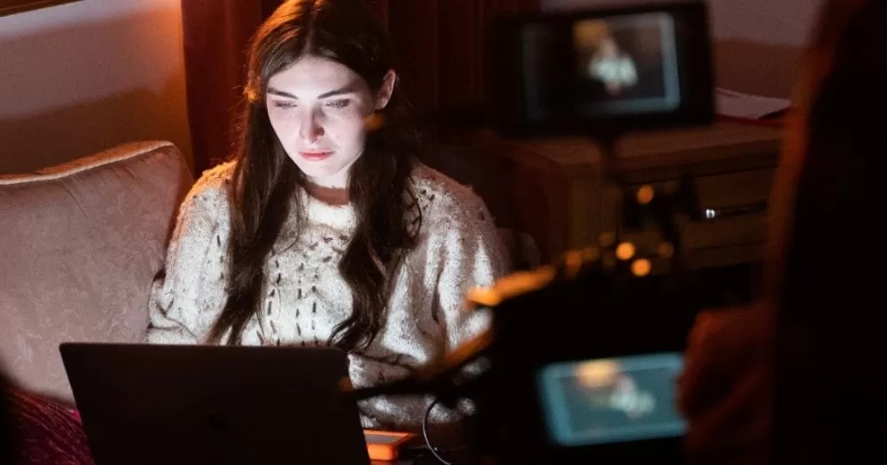 A behind the scene shot of an actor on set of a film by Liadán Roche.