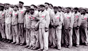 Prisoners with the pink triangle in the concentration camp at Sachsenhausen, Germany, 1938. Image from the National Archives and Records Administration (540175).