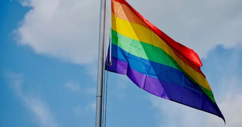 A Pride flag waving in the wind. This image is being used to represent an upcoming history project from Dublin City Council.