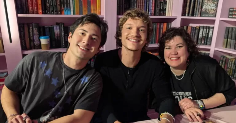 Rachel Reid sits with the stars of Heated Rivalry