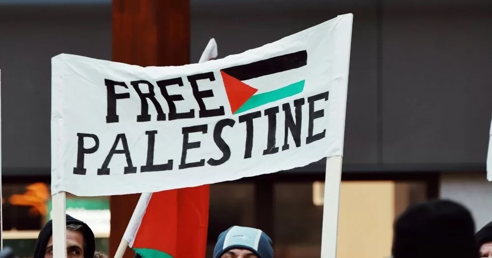 A banner that reads Free Palestine.